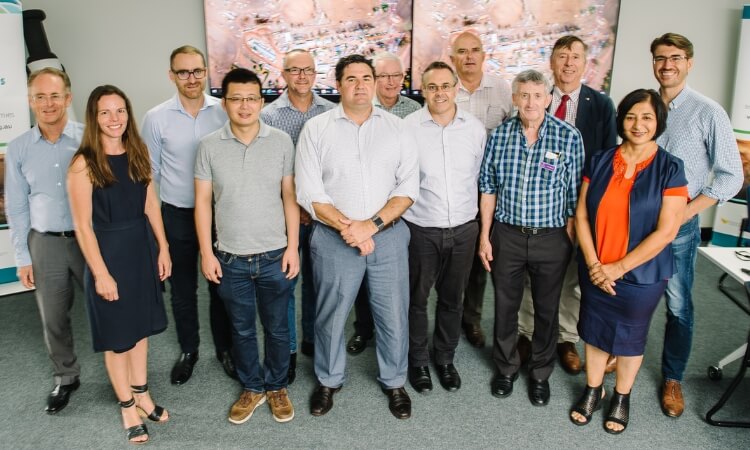 rural economies staff smiling as a group for the camera