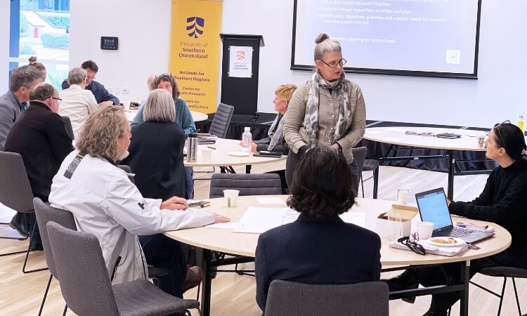 woman in a meeting sharing information