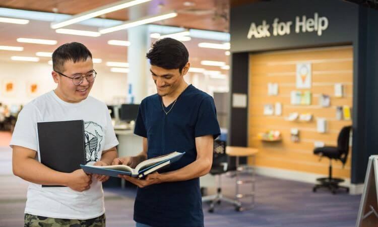 two students in the library
