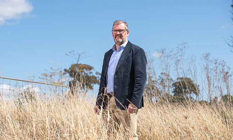 John McVeigh standing in a field