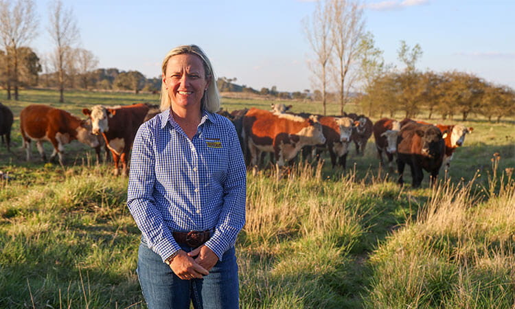Kylie Falconer in field with cows