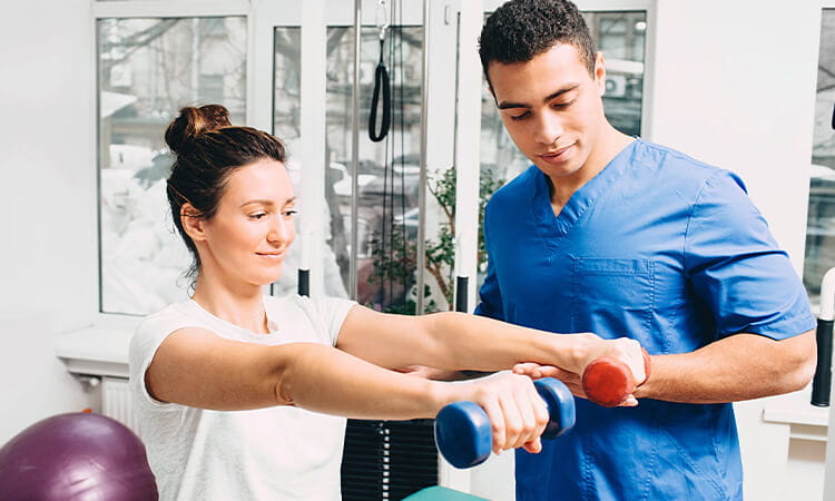 Lady completing physiotherapy exercise.