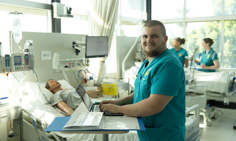 A nurse student working in a mock hospital. 