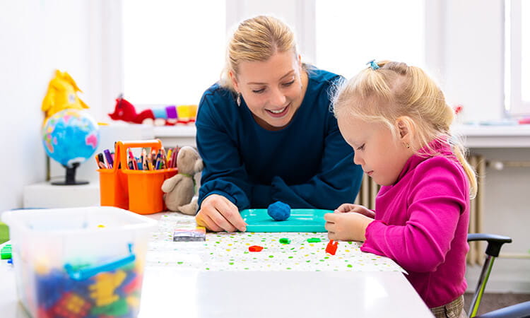 Occupational therapist working with a child.