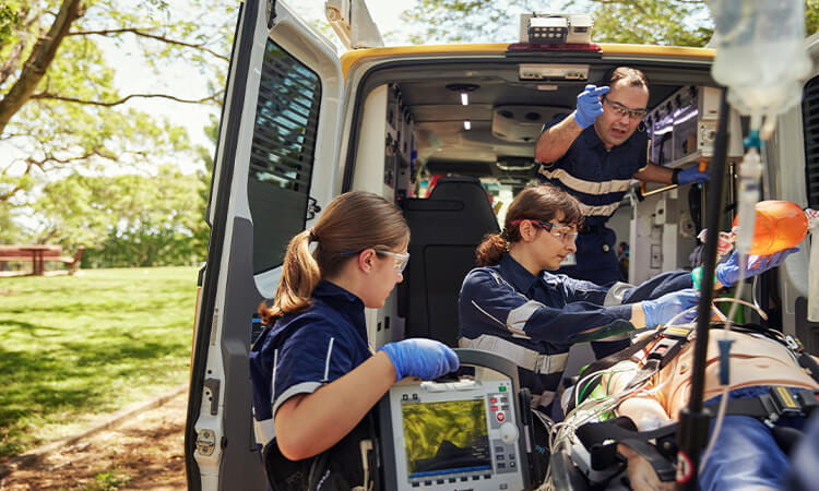 paramedics working on a patient.