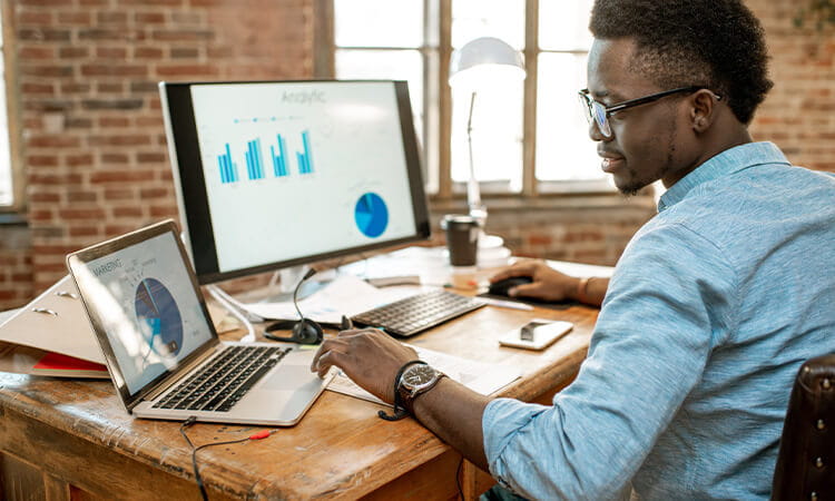 A software developer working at a computer. 