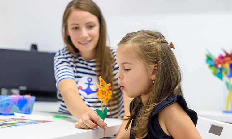 Speech Pathologist helping a child. 