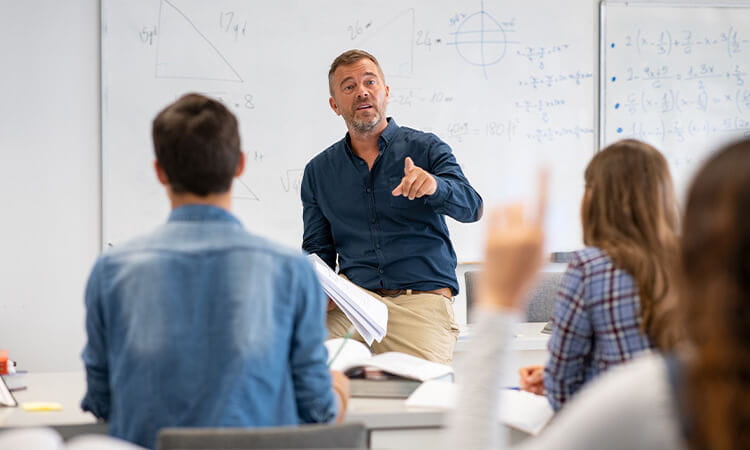 High school teacher teaching class.