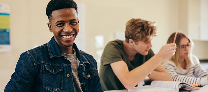 Young man studying in classroom