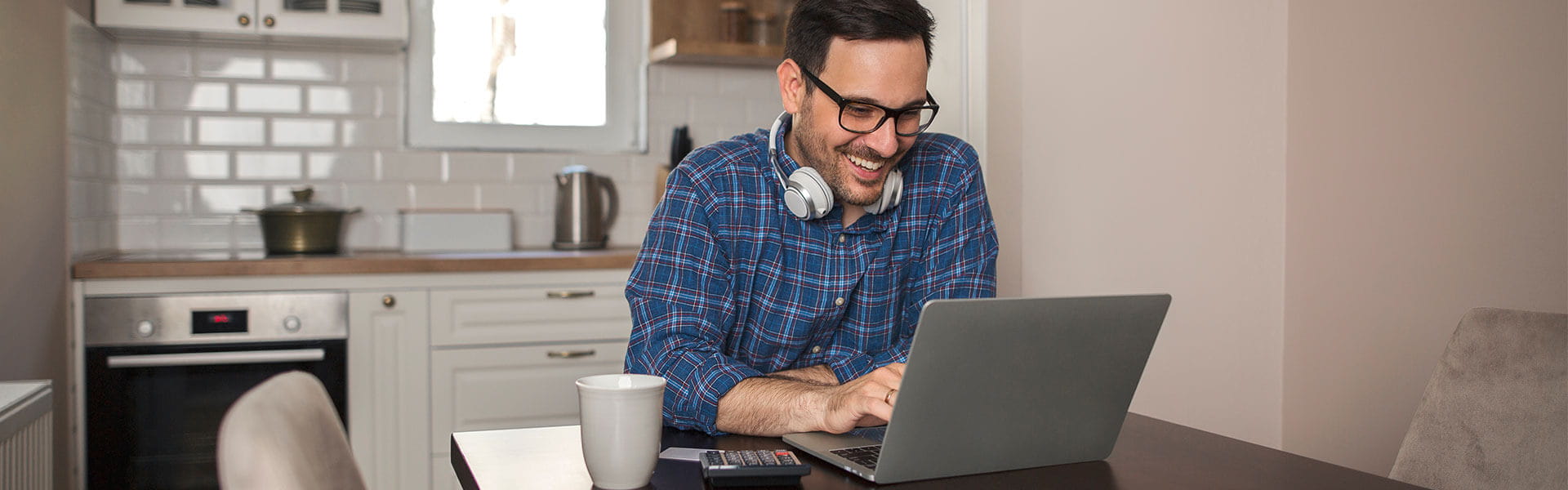 Man studying in kitchen