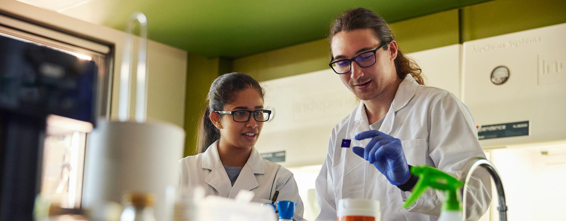 Two people working in a science lab.