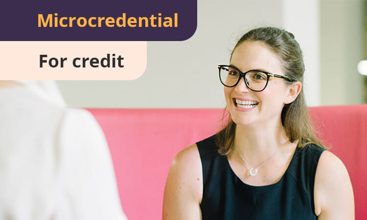 A woman in glasses smiles while sitting on a pink couch. Text reads "Microcredential for credit.