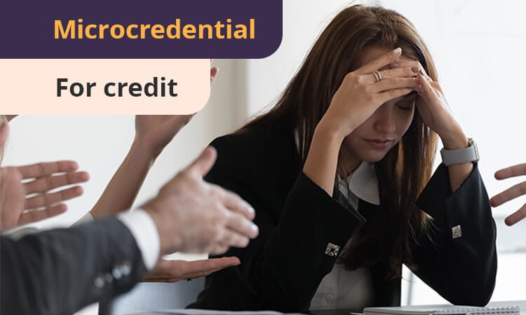 A woman sits with her head in her hands at a desk, surrounded by gesturing hands. Text reads, "Microcredential for credit.