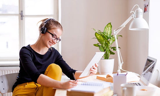 Female sitting at desk, working.