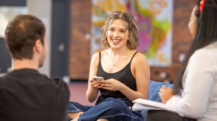 Students talking in a group. 