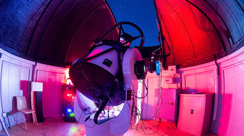 Telescope looking up at night sky