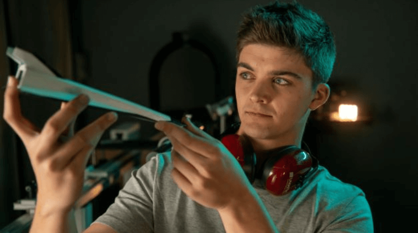 UniSQ aerospace engineer looking at a model rocket